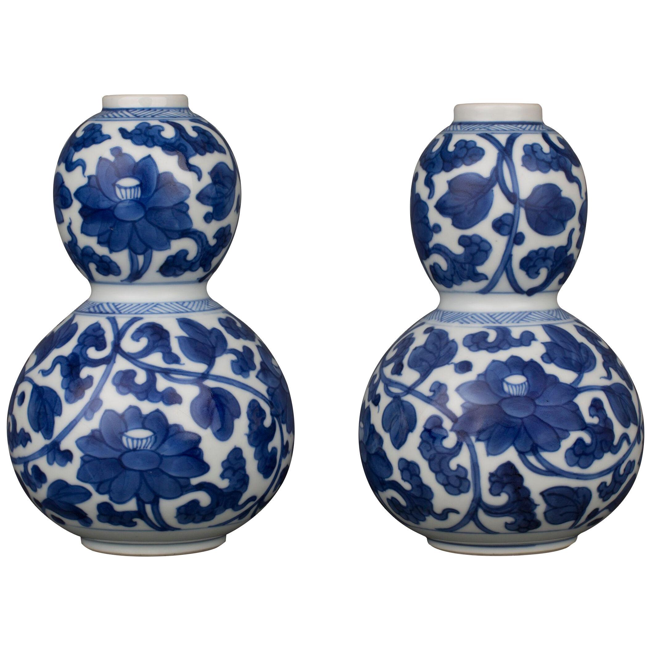 A pair of Chinese porcelain blue and white vases of double gourd form