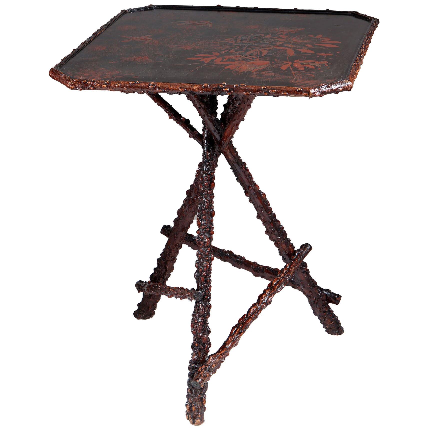A Victorian rustic table with lacquered top