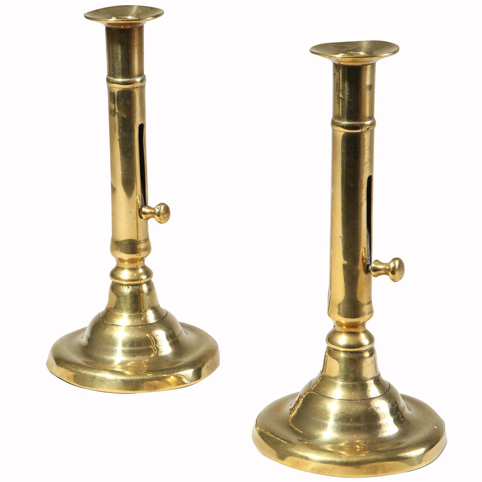 A pair of 18th century brass candlesticks