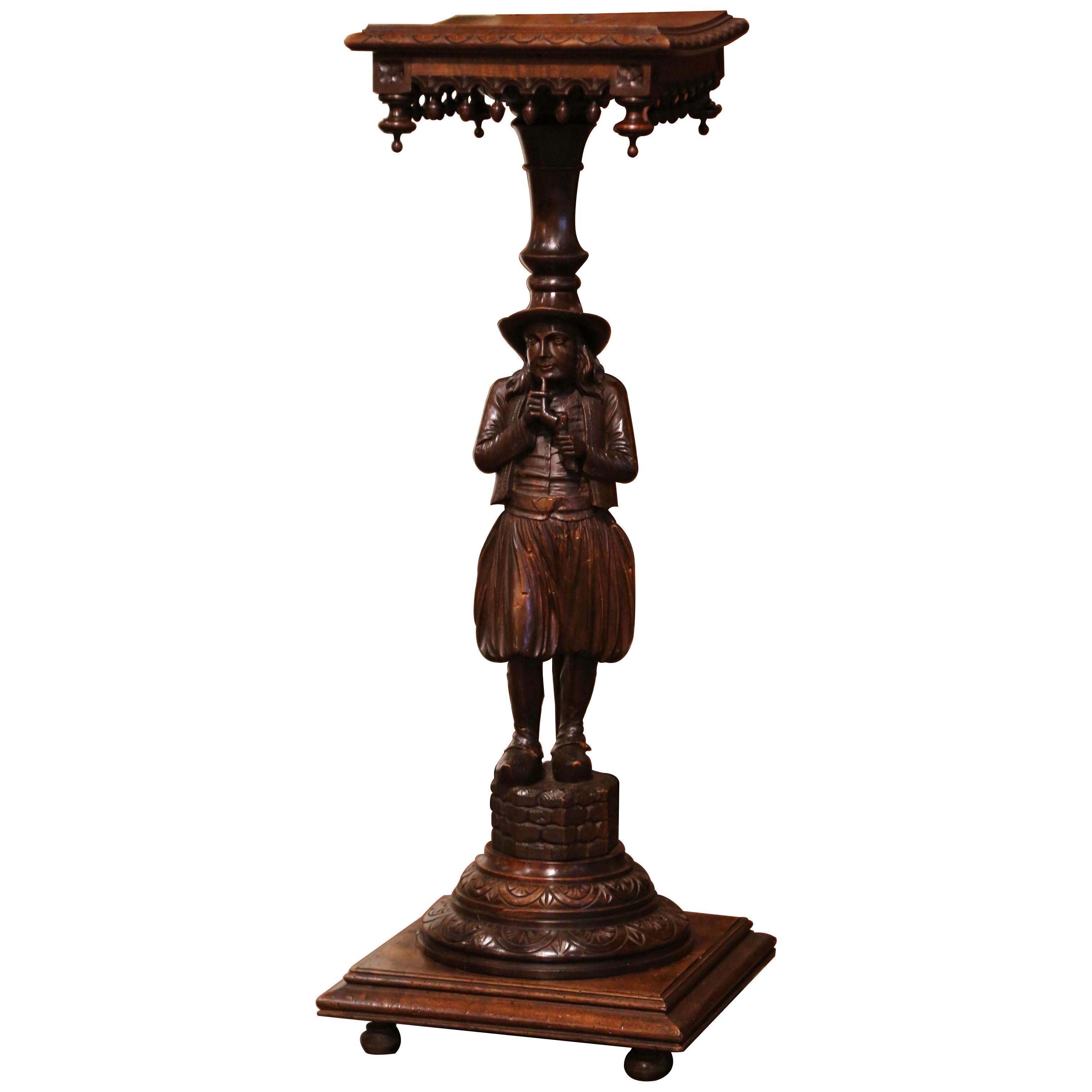 19th Century French Carved Chestnut Pedestal Table with Breton Man Figure