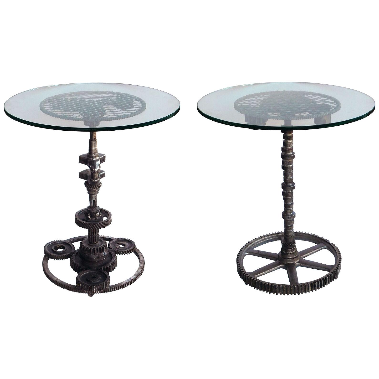 Pair of industrial cast iron wheel tables with circular glass tops