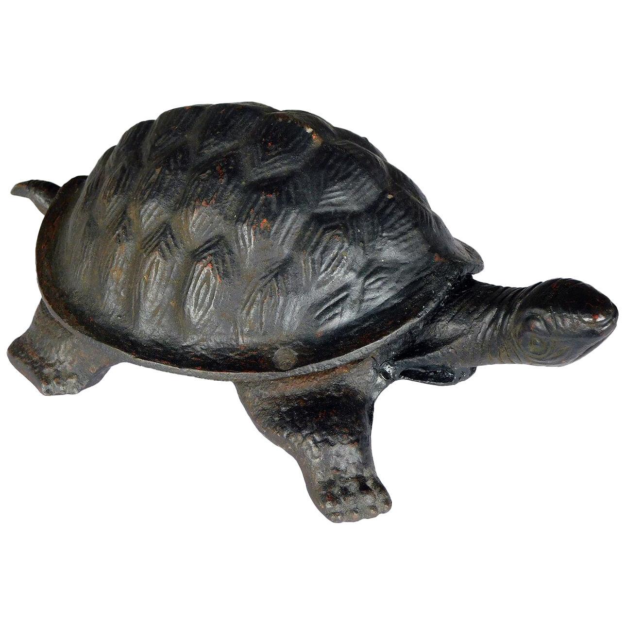 Whimsical cast iron black-painted turtle-form door stop/garden ornament