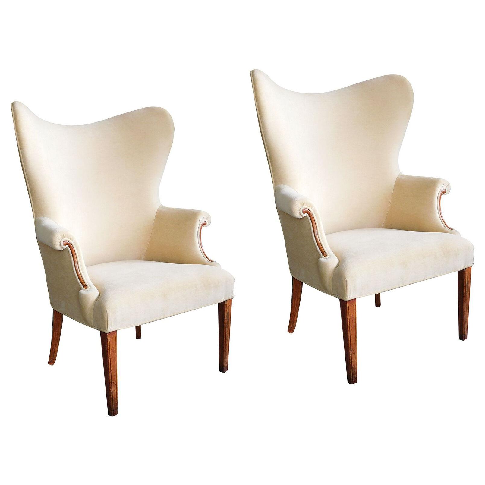 Handsome pair of American 1940's butterfly wingback arm chairs