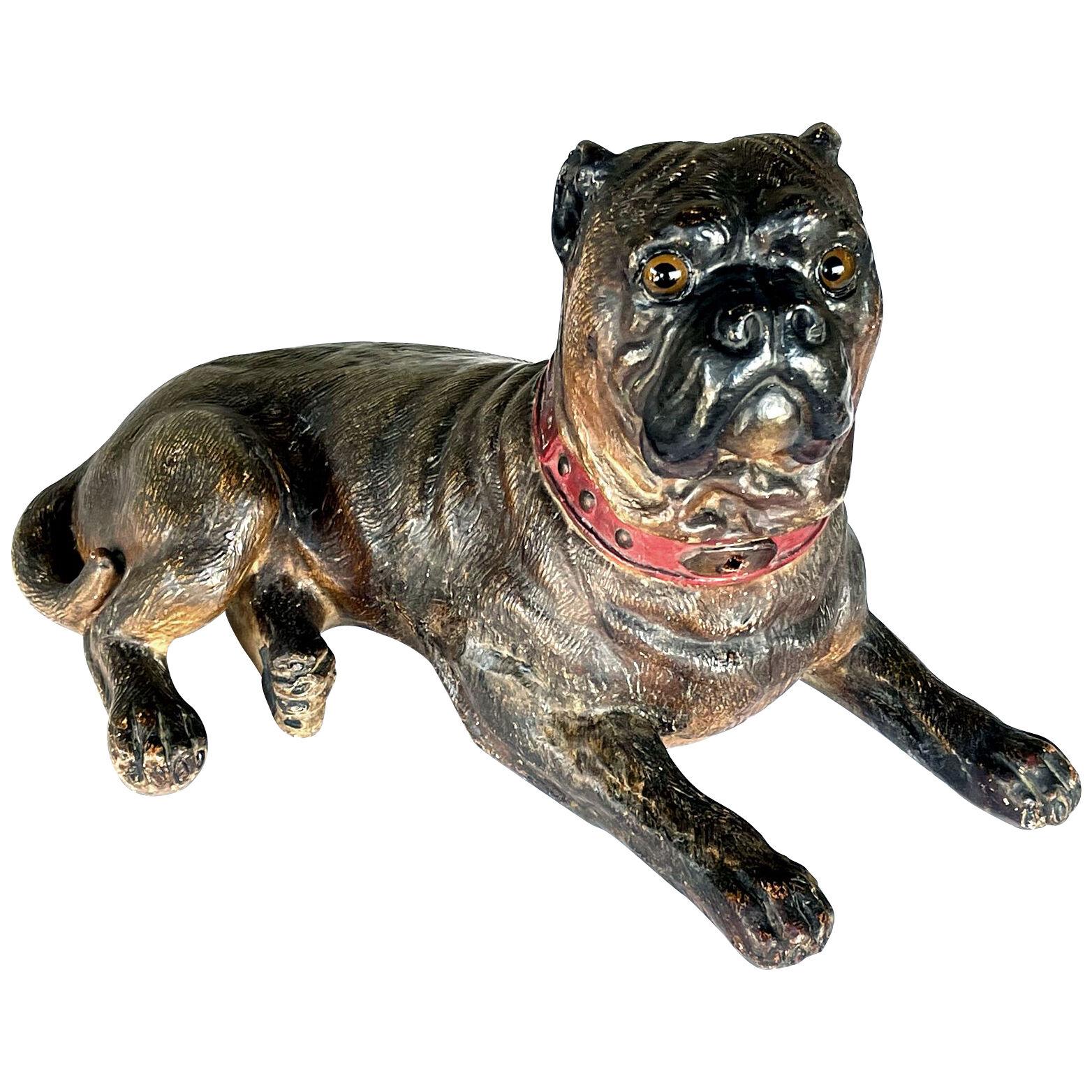 An Austrian painted terracotta model of a recumbent bull dog