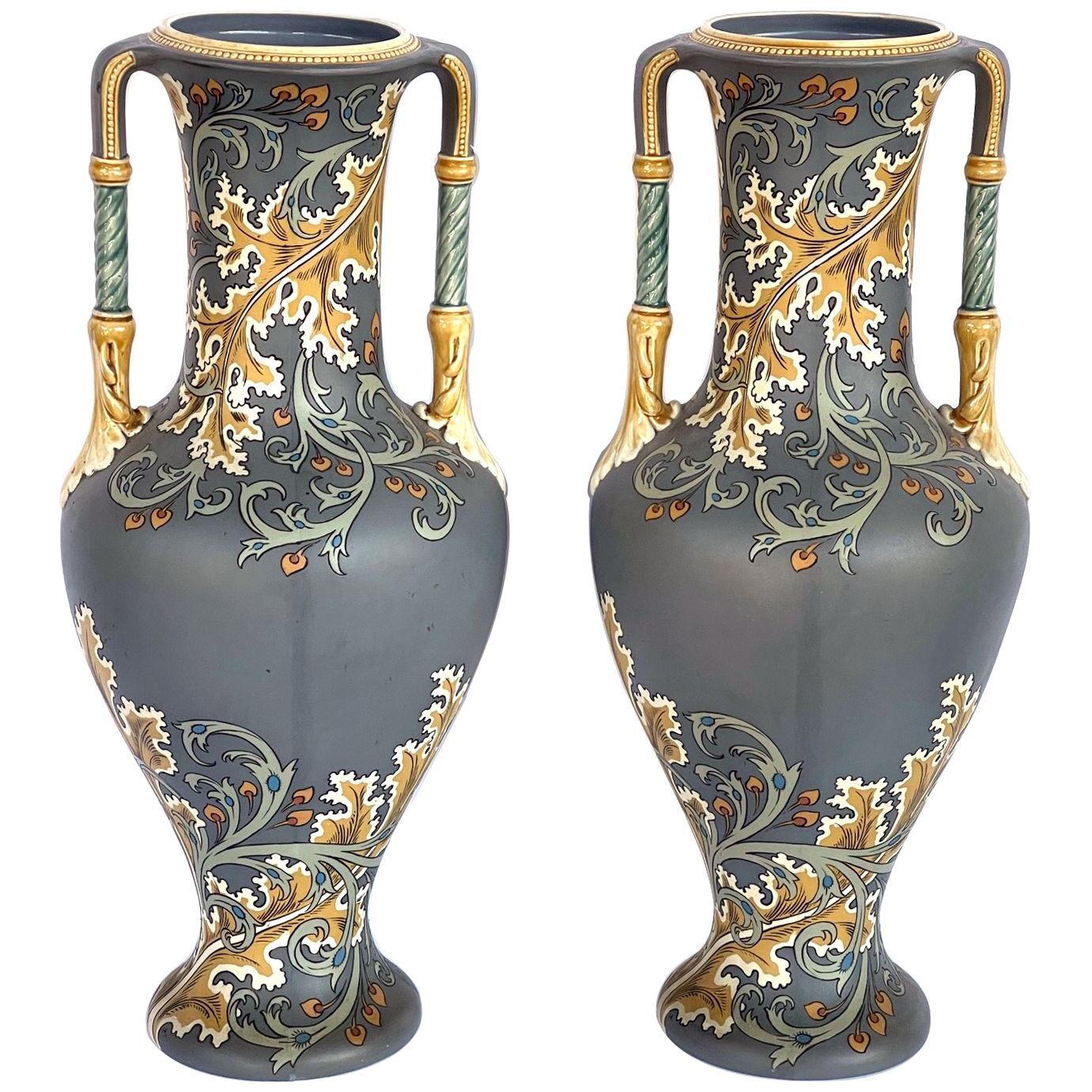 Pair of art nouveau Mettlach pottery vases eith incised markings on underside