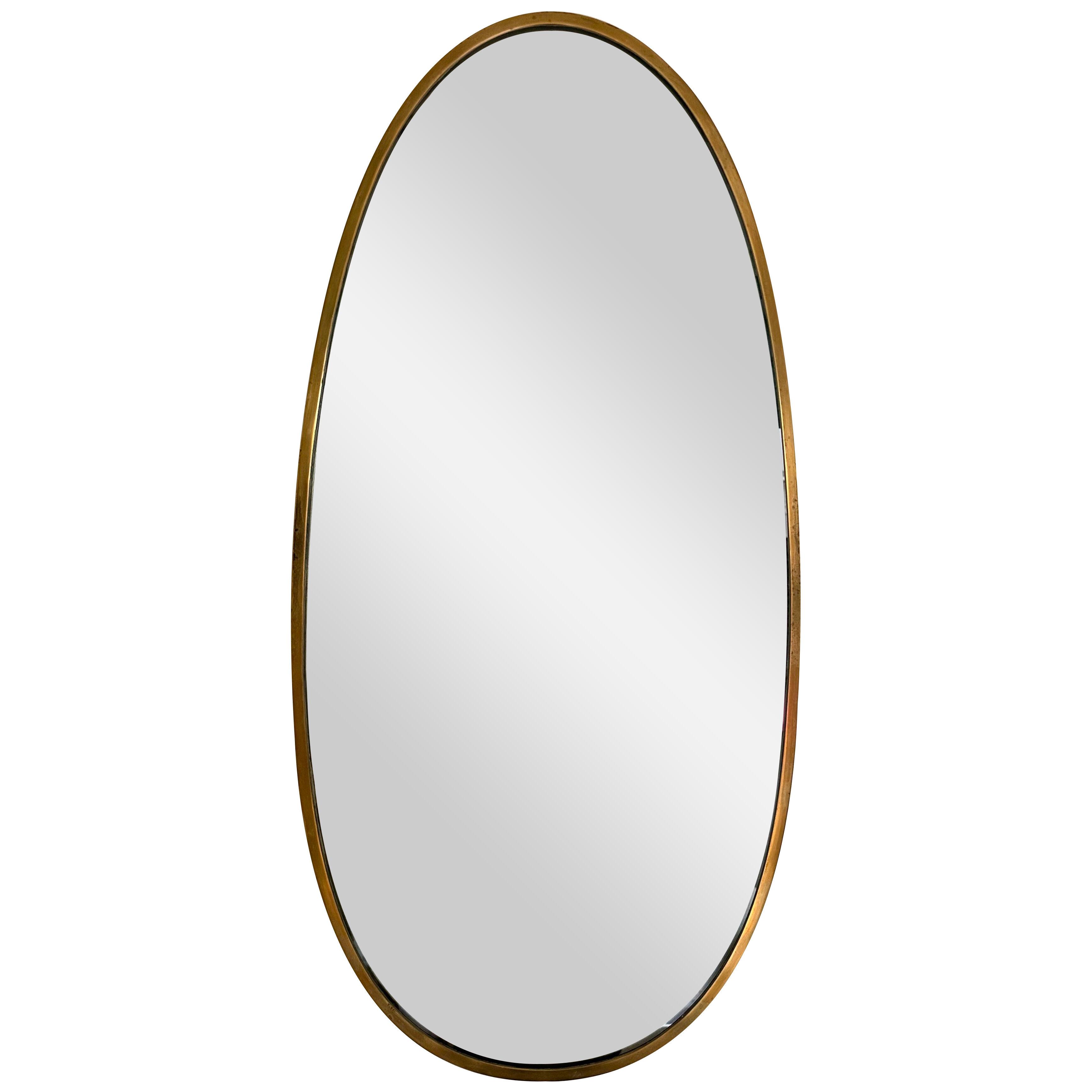 Brass Free Form Egg Mirror. Italy, 1950s