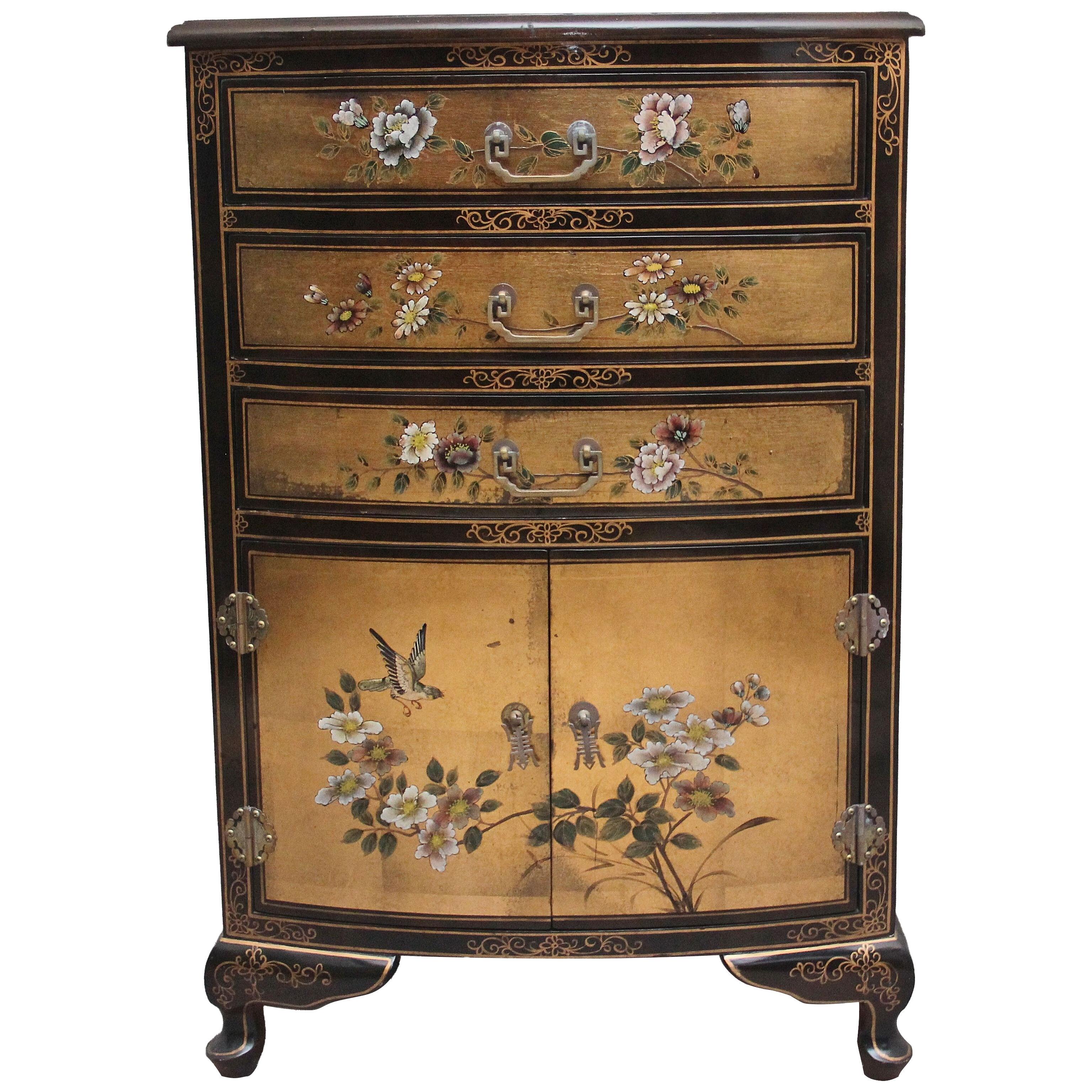 A decorative mid 20th Century painted and lacquered cabinet