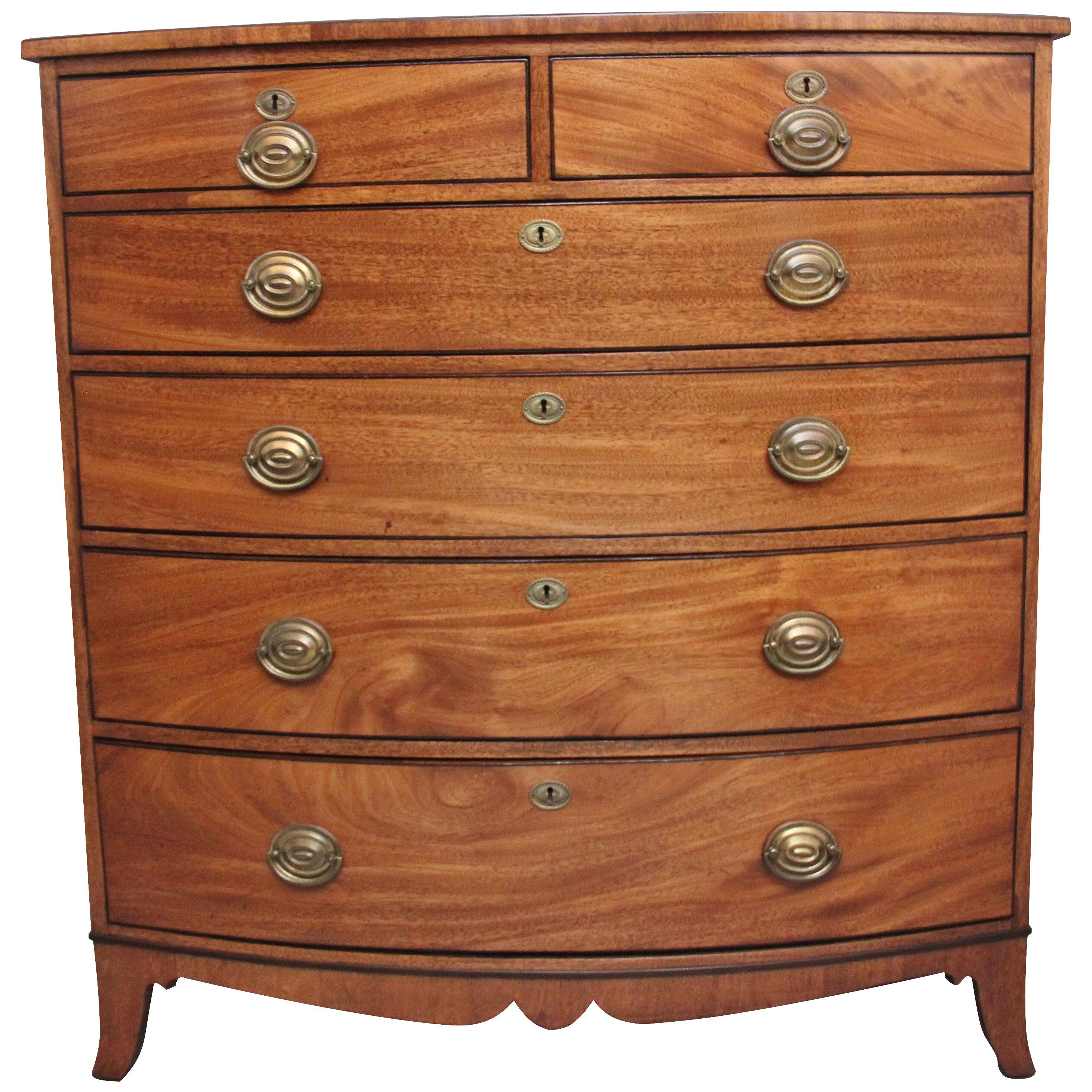 A superb quality Early 19th Century tall mahogany bowfront chest of drawers