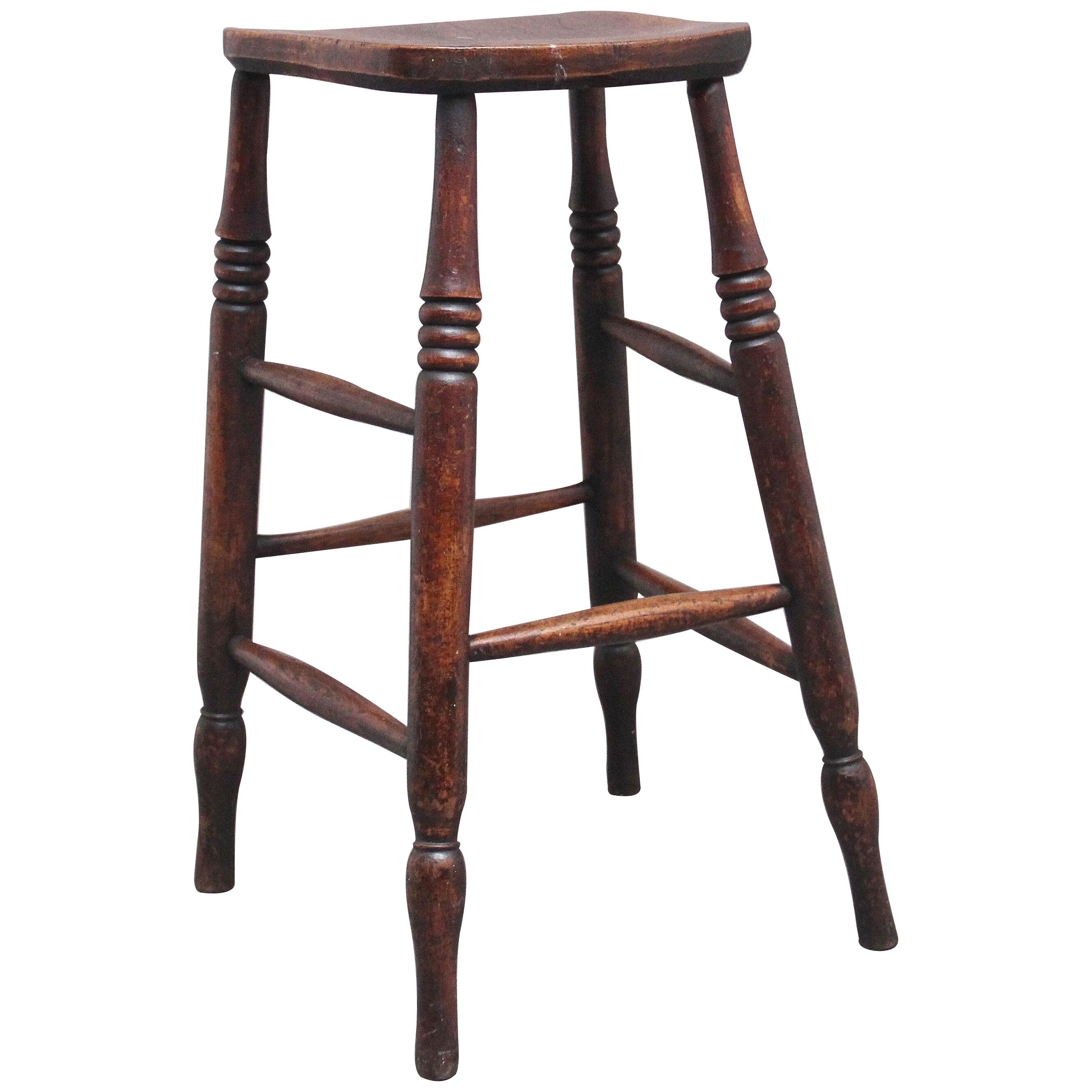 A tall mid 19th Century ash and elm stool