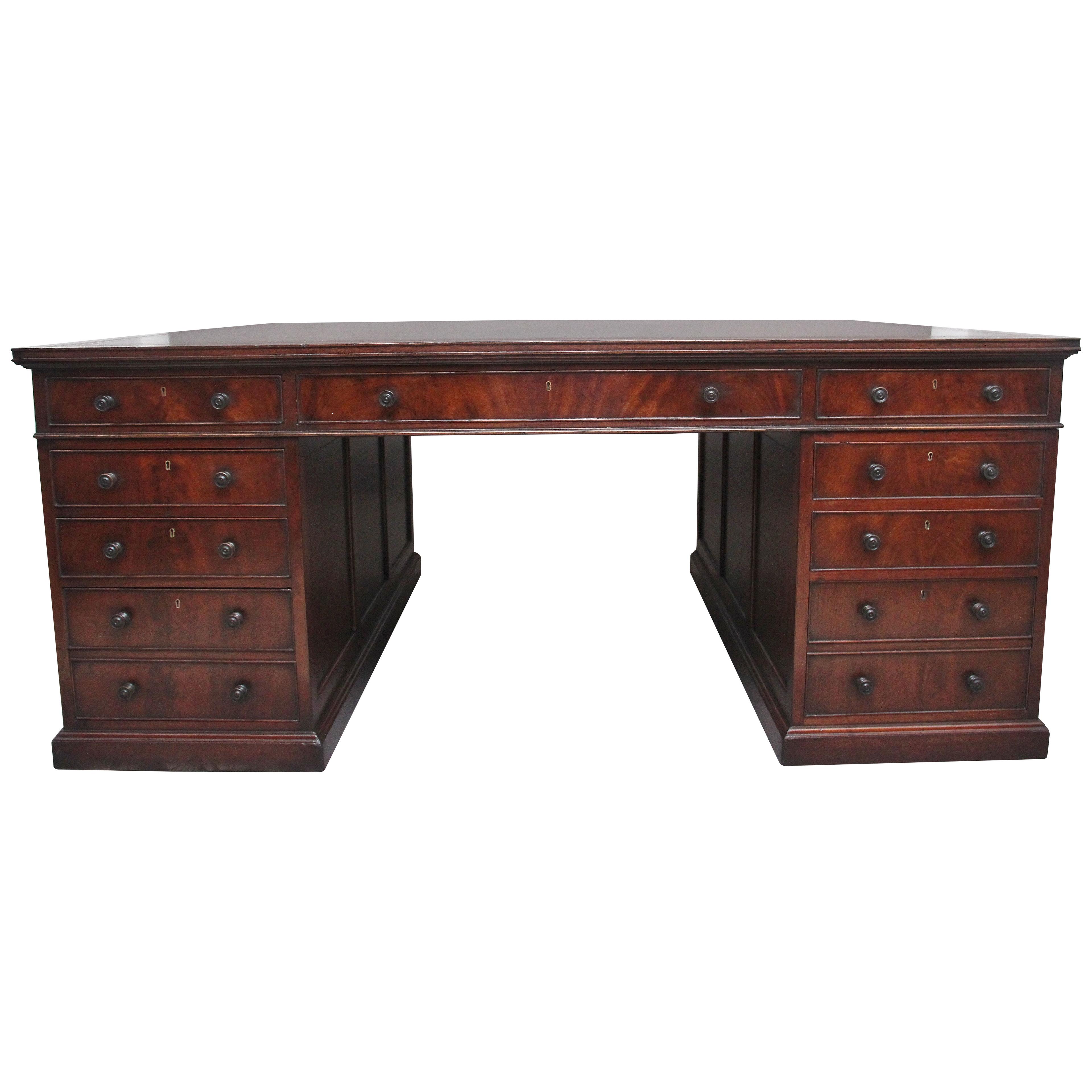 A large and impressive early 20th Century mahogany partners desk