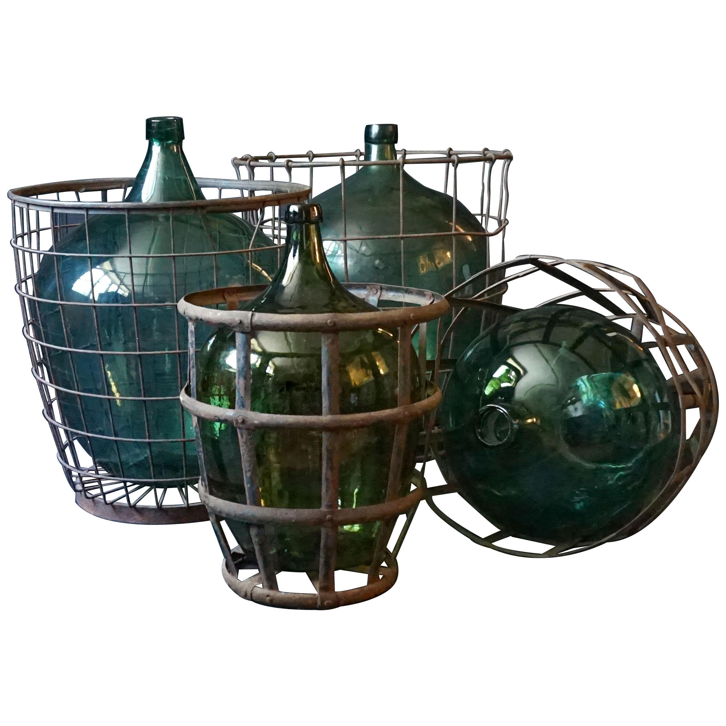 Set of Four 1920s French Green Demijohns, Lady Jeanne or Carboys in Metal Basket