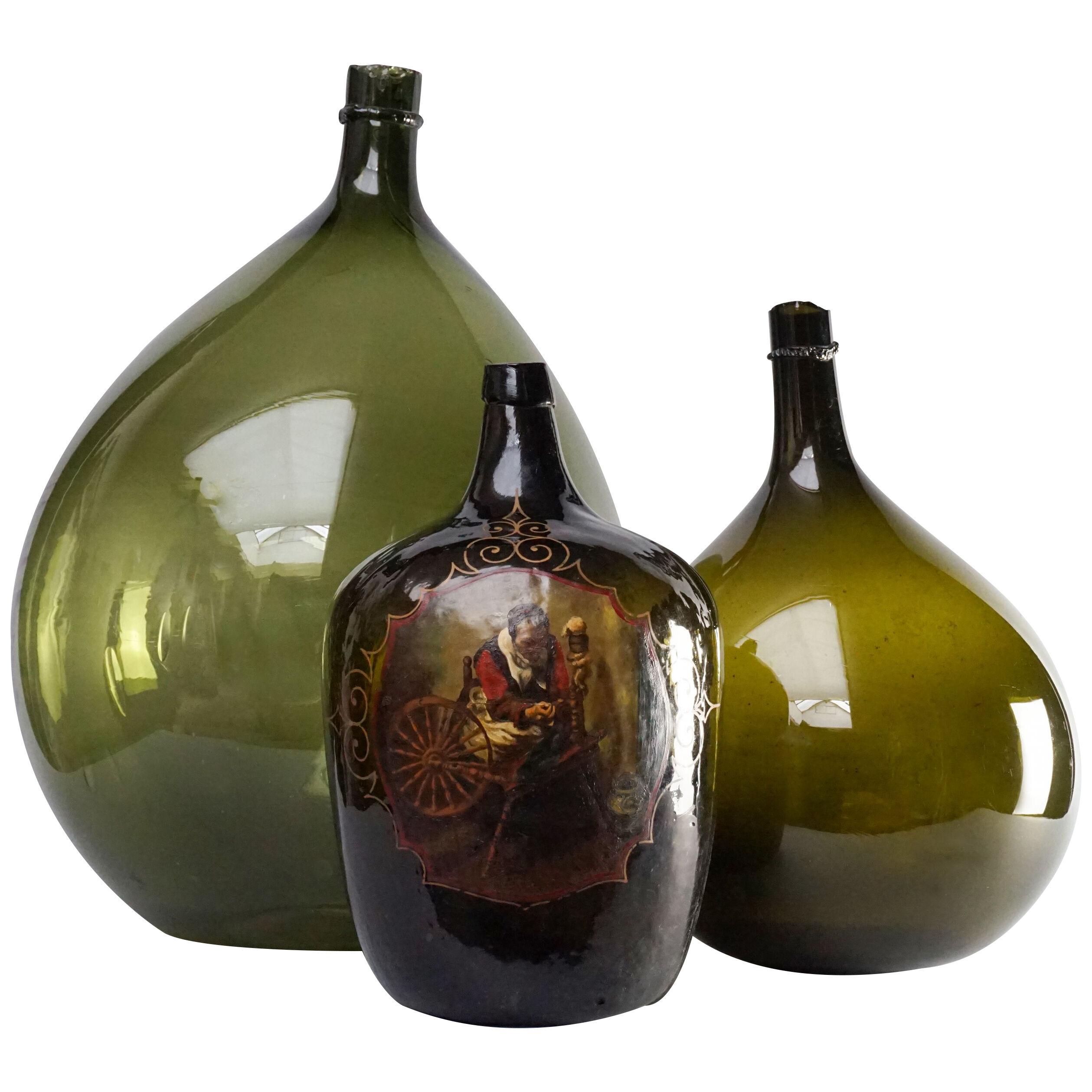 Set of Three 19th Century Italian Blown Demijohn or Damigiana Glass Bottles